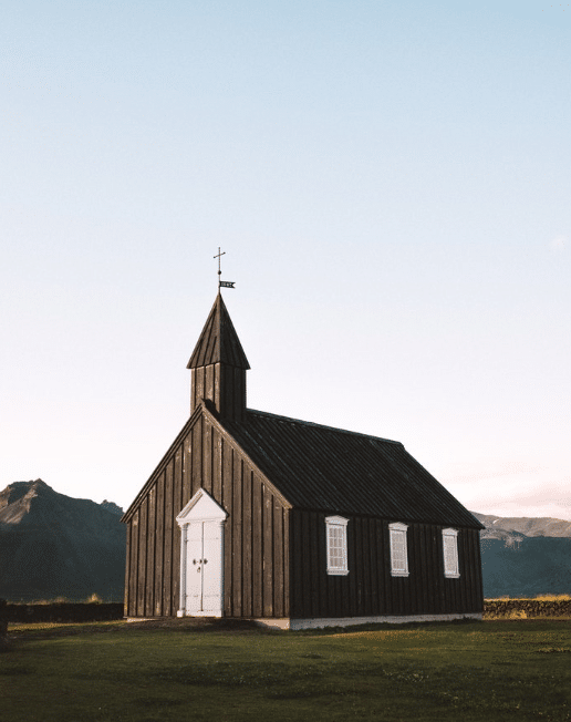 small church building by mountain view
