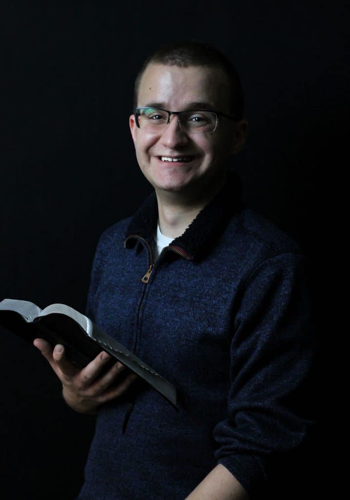 Zachary Murphy holding Bible